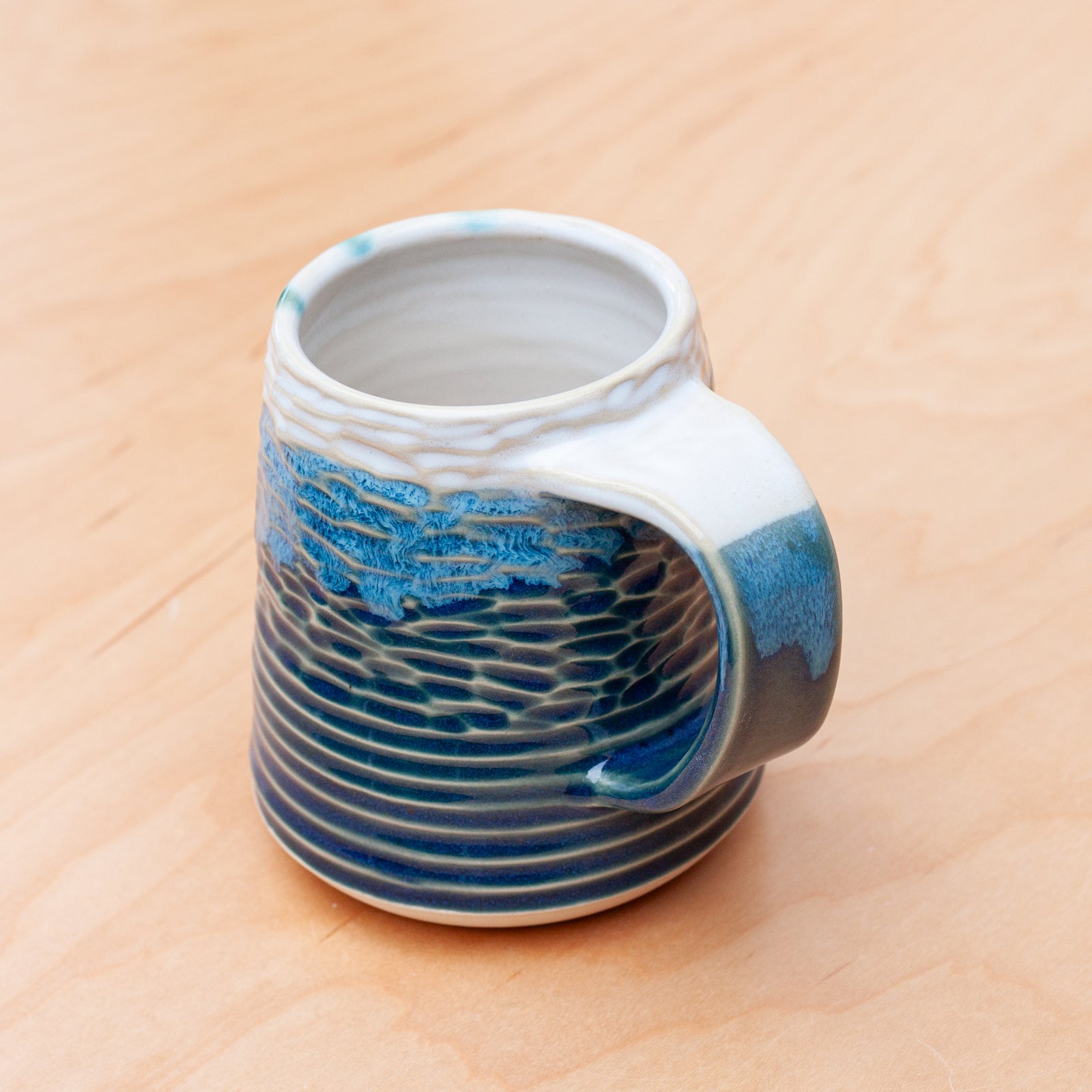 Saturn Carved Stein in Pacific